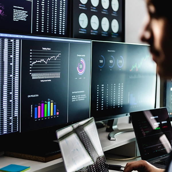 AI data analytics dashboard displayed across multiple screens with real-time charts, graphs, and performance metrics